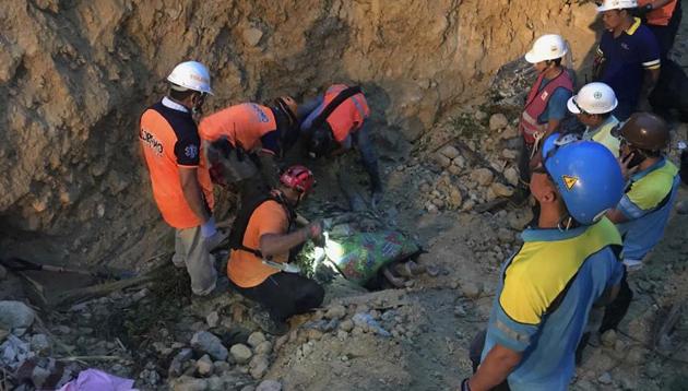 Security forces and rescue workers raced to uncover dozens feared trapped, in the latest of a series of deadly incidents in the past week. (AP) Security forces and rescue workers raced to uncover dozens feared trapped, in the latest of a series of deadly incidents in the past week. (AP)