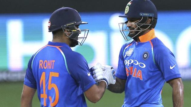 India's Shikhar Dhawan, right, and captain Rohit Sharma greet each other. (AP)