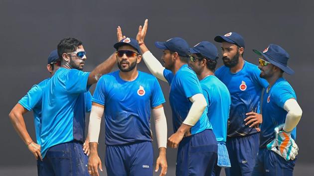 Delhi bowler Manan Sharma (L) and his teammates celebrate after taking the wicket of Saurashtra batsman Sheldon Philip Jackson (not in the picture) during the Vijay Hazare trophy cricket match, at the Ferozshah Kotla ground.(PTI)