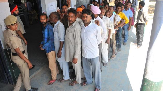 Voters queued outside a polling booth at Bad Majra village in Mohali on Wednesday. (Ravi Kumar/HT) Voters queued outside a polling booth at Bad Majra village in Mohali on Wednesday. (Ravi Kumar/HT)