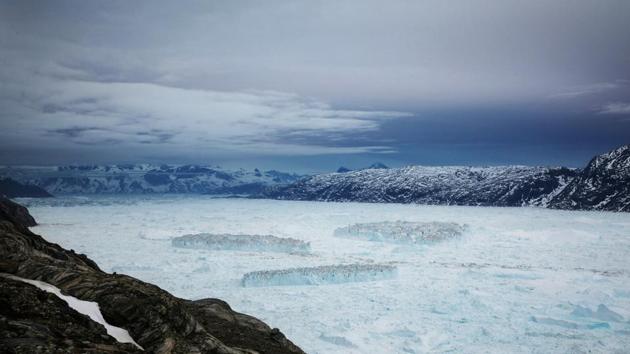 Tabular icebergs float in the Sermilik Fjord after a large calving event at the Helheim glacier. Melting ice in Greenland currently adds 0.8 millimeters of water to global ocean levels annually, more than any other region, according to NASA. That’s enough water to fill 115 million Olympic-sized swimming pools. (Lucas Jackson / REUTERS) Tabular icebergs float in the Sermilik Fjord after a large calving event at the Helheim glacier. Melting ice in Greenland currently adds 0.8 millimeters of water to global ocean levels annually, more than any other region, according to NASA. That’s enough water to fill 115 million Olympic-sized swimming pools. (Lucas Jackson / REUTERS)