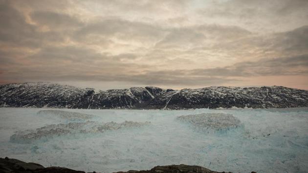 Tabular icebergs float in the Sermilik Fjord. For both journalists and scientists, climate change is difficult to document. It most often happens imperceptibly - a tenth of a degree increase in temperature, a few less inches of rain, a slowly melting ice sheet. That’s why Jackson said it was so overwhelming to watch billions of tons of ice collapse at all once. Suddenly it didn’t feel like a small or distant problem. (Lucas Jackson / REUTERS) Tabular icebergs float in the Sermilik Fjord. For both journalists and scientists, climate change is difficult to document. It most often happens imperceptibly - a tenth of a degree increase in temperature, a few less inches of rain, a slowly melting ice sheet. That’s why Jackson said it was so overwhelming to watch billions of tons of ice collapse at all once. Suddenly it didn’t feel like a small or distant problem. (Lucas Jackson / REUTERS)