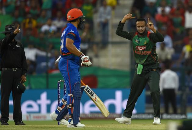Bangladesh cricketer Shakib Al Hasan (R) celebrates after he dismissed Afghan batsman Mohammad Nabi during the one day international (ODI) Asia Cup cricket match between Bangladesh and Afghanistan at the Sheikh Zayed Stadium in Abu Dhabi. (AFP)