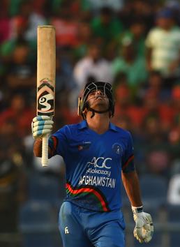 Afghan batsman Hashmatullah Shahidi celebrates after scoring a half-century (50 runs) during the one day international (ODI) Asia Cup cricket match between Bangladesh and Afghanistan at the Sheikh Zayed Stadium in Abu Dhabi. (AFP)