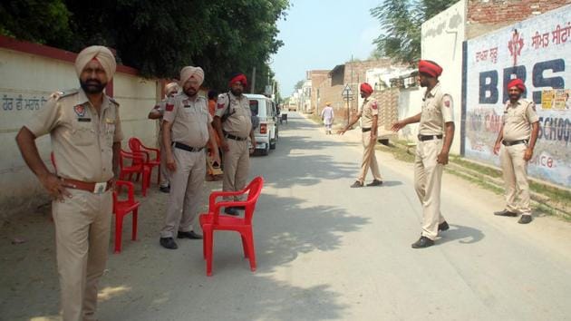 Security personnel deployed outside polling station in Dayalpura Mirza village n Bathinda during re - polling at booth for zila parishad and block samiti elections.(Sanjeev Kumar/HT)