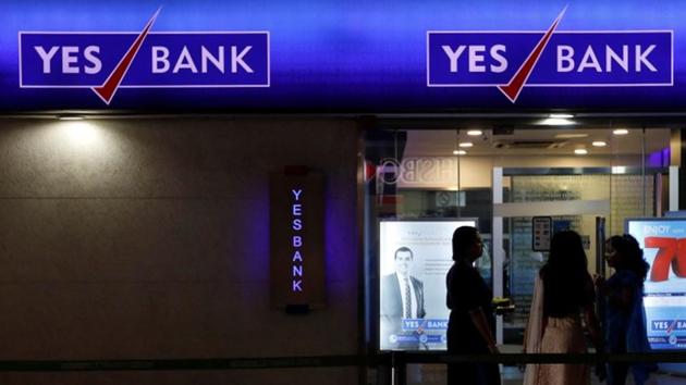 Employees enter a Yes Bank branch at its headquarters in Mumbai.(Reuters File Photo) Employees enter a Yes Bank branch at its headquarters in Mumbai.(Reuters File Photo)