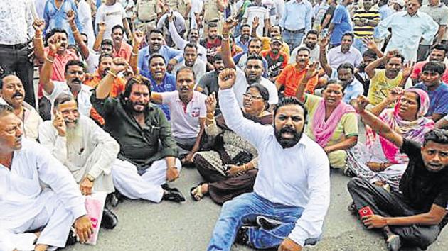 The agitating employees are not picking up garbage from neighbourhoods to protest the non-payment of salaries and pending arrears.(Pardeep Pandit/HT Photo) The agitating employees are not picking up garbage from neighbourhoods to protest the non-payment of salaries and pending arrears.(Pardeep Pandit/HT Photo)