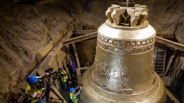 A picture released by the communication services of the foundry in Przmysl shows the world’s largest bell, weighing 55 tons, during its unveiling ceremony at the Metalodlew foundry in Krakow, Poland. The bell is destined for the Basilica of the Eternal Divine Father in Trinidade, a major pilgrimage site in Brazil. (Dominik Gajda / Foundry Pres Office / AFP)