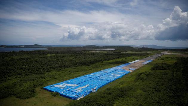 About 20,000 pallets of unused water bottles are seen along an aeroplane runway a year after Hurricane Maria devastated Puerto Rico in Ceiba, Puerto Rico. (Carlos Barria / REUTERS)