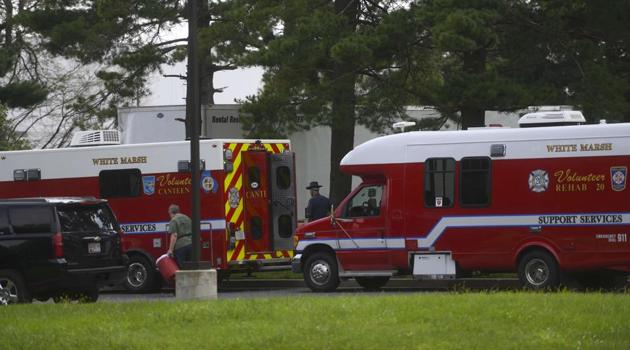 Police gather outside a Rite Aid Distribution Center, where multiple people were killed and injured in a shooting on September 20. (AFP Photo) Police gather outside a Rite Aid Distribution Center, where multiple people were killed and injured in a shooting on September 20. (AFP Photo)