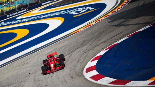 Ferrari’s German driver Sebastian Vettel drives at the Marina Bay Street Circuit during the first practice session ahead of the Singapore Formula One Grand Prix. (Jewel Samad / AFP)