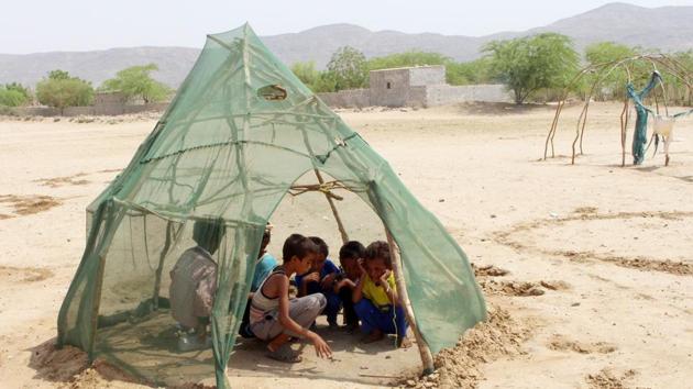 Displaced Yemeni children from Hodeida play in a shelter at a makeshift camp in a village in the northern district of Abs in Hajjah province, Yemen. (Essa Ahmed / AFP)