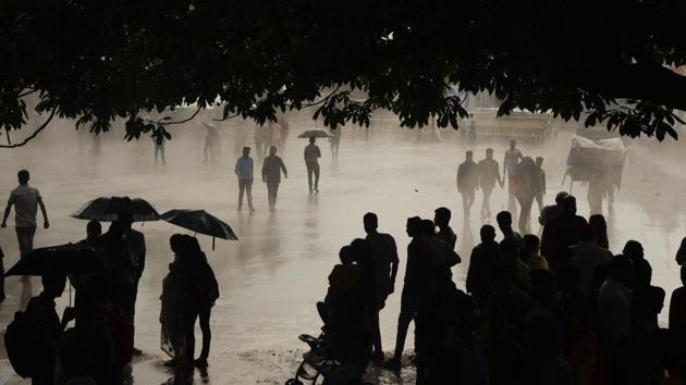 People protect themselves with umbrellas during rains in Shimla on September 20, 2018. (PTI) People protect themselves with umbrellas during rains in Shimla on September 20, 2018. (PTI)