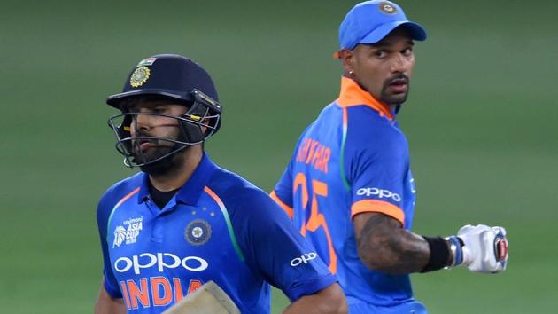 Rohit Sharma (L) and Shikhar Dhawan (R) run between the wickets during the Asia Cup 2018 match against Bangladesh.(AFP)