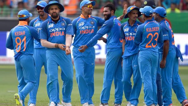 Indian cricketer Shikhar Dhawan (C) celebrates with teammate after dismissing Bangladesh batsman Shakib Al Hasan. (AFP)