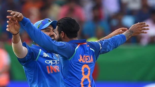 Indian Cricket team captain Rohit Sharma (L) celebrates with teammate Ravindra Jadeja after he dismissed Bangladesh batsman Mushfiqur Rahim (AFP) Indian Cricket team captain Rohit Sharma (L) celebrates with teammate Ravindra Jadeja after he dismissed Bangladesh batsman Mushfiqur Rahim (AFP)