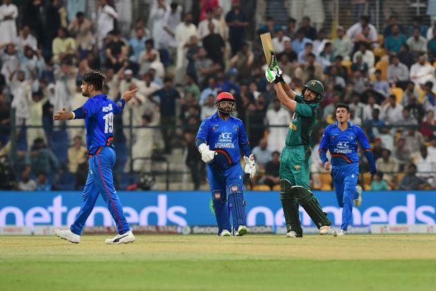 Afghanistan's Rashid Khan (L) celebrates after he dismiss Pakistan's Mohammad Nawaz (R) during the one day international. (AFP)