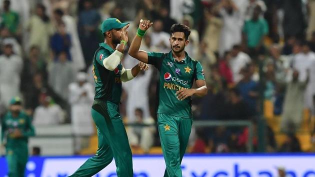 Pakistan's Hasan Ali (R) celebrates after he dismissed Afghanistan batsman Najibullah Zadran.(AFP)