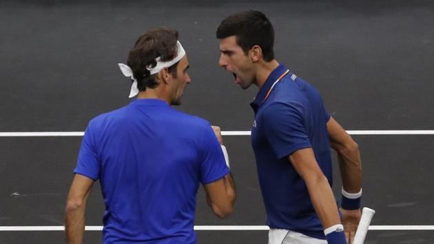Team Europe's Roger Federer, left, and Novak Djokovic celebrate a point against Team World's Jack Sock and Kevin Anderson during a doubles tennis match at the Laver Cup.(AP)