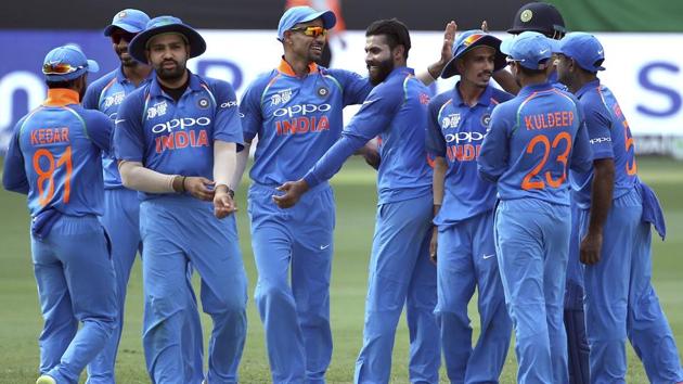 India's Ravindra Jadeja, center without cap, celebrates with teammates the dismissal of Bangladesh's Shakib Al Hasan.(AP)