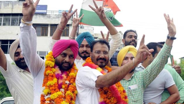 Congress candidates celebrate their win in zila parishad polls in Patiala on Saturday.(HT Photo)