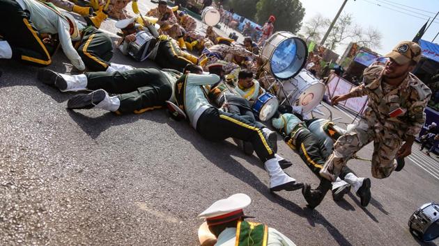 This picture taken on September 22, 2018 in the southwestern Iranian city of Ahvaz shows a soldier running past injured comrades lying on the ground at the scene of an attack on a military parade. (AFP Photo) This picture taken on September 22, 2018 in the southwestern Iranian city of Ahvaz shows a soldier running past injured comrades lying on the ground at the scene of an attack on a military parade. (AFP Photo)