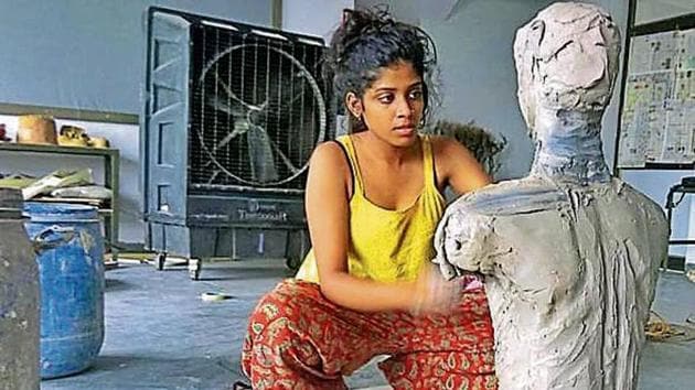 A student works on a sculpture at visual arts department in fine arts faculty at Rajasthan University.(HT Photo)