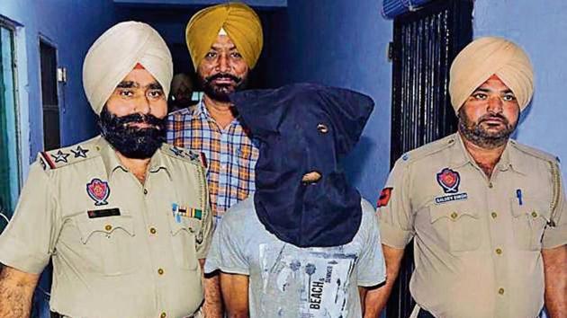 The accused in Amritsar police custody on Sunday. (HT Photo) The accused in Amritsar police custody on Sunday. (HT Photo)