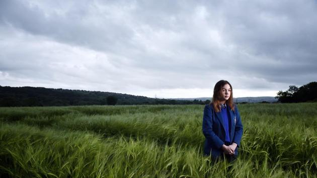 Catriona Walsh stands in a barley field along the Irish border in Londonderry. Catriona attends nearby St. Mary’s college in Derry and her journey to and from school threads through the border. She said, “At most we will have checkpoints which will take a great step back into the past of Northern Ireland and my biggest fear is that it will damage my future education through travelling to university and affecting my pathway of study.” (Charles McQuillan / Getty Images) Catriona Walsh stands in a barley field along the Irish border in Londonderry. Catriona attends nearby St. Mary’s college in Derry and her journey to and from school threads through the border. She said, “At most we will have checkpoints which will take a great step back into the past of Northern Ireland and my biggest fear is that it will damage my future education through travelling to university and affecting my pathway of study.” (Charles McQuillan / Getty Images)