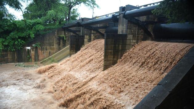 For first time in a decade, two of Sukhna Lake’s floodgates were opened due to incessant rain in the region after its water level crossed the 1,163 feet mark. (Sanjeev Sharma/HT )