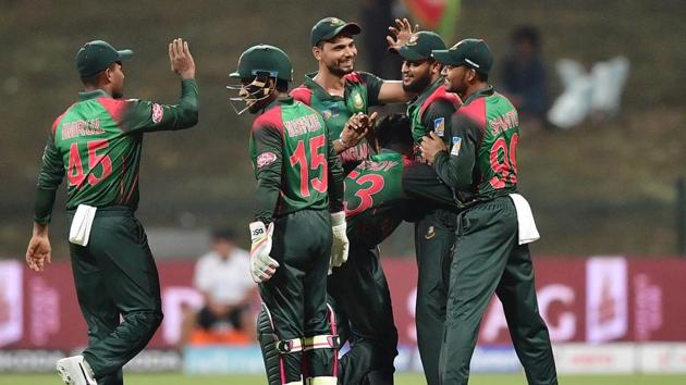Bangladesh Nazmul Islam celebrates with his team after he dismissed Afghanistan batsman Rahmat Shah during the one day international (ODI) Asia Cup cricket match between Afghanistan and Bangladesh at The Sheikh Zayed Stadium in Abu Dhabi on September 23, 2018. (Photo by GIUSEPPE CACACE / AFP) (AFP)