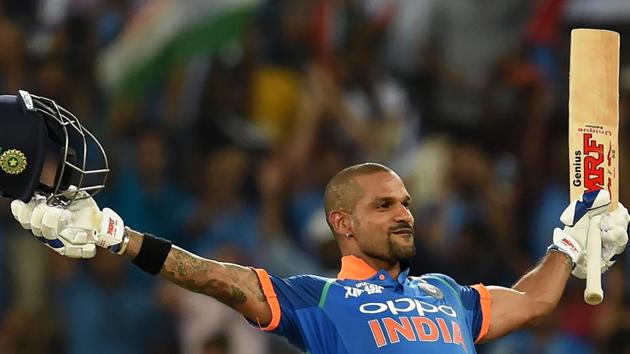 Indian batsman Shikhar Dhawan celebrates after scoring a century (100 runs) during the one day international (ODI) Asia Cup cricket match between Pakistan and India at the Dubai International Cricket Stadium in Dubai.(AFP)