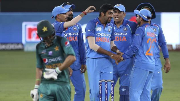 India's Jasprit Bumrah, center without cap, celebrates with teammates the dismissal of Pakistan's Shoaib Malik. (AP) India's Jasprit Bumrah, center without cap, celebrates with teammates the dismissal of Pakistan's Shoaib Malik. (AP)
