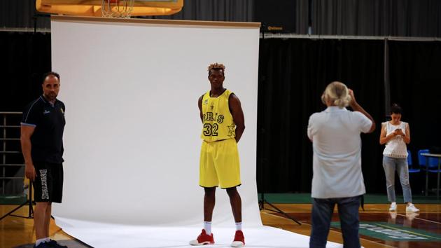 Since June, Wamba, whose full name is Christ Wamba Bouassou Joachim Mossai Fidele - trains in Aris’s yellow jersey as shooting guard and forward. Without legal status, he’s banned from playing. “He’s very cooperative, he’s a great kid and he deserves this opportunity. We’re happy to have him,” Aris coach Vangelis Angelou said. (Alkis Konstantinidis / REUTERS) 
