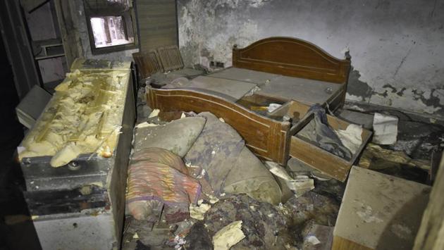 On the floor there are undergarments and a child-sized left shoe – possibly belonging to one of the children killed inside. There is a bed with most of its wood missing, no mattress or clothes in sight. The lockers are empty — its wood missing too. (Burhaan Kinu / HT Photo) On the floor there are undergarments and a child-sized left shoe – possibly belonging to one of the children killed inside. There is a bed with most of its wood missing, no mattress or clothes in sight. The lockers are empty — its wood missing too. (Burhaan Kinu / HT Photo)