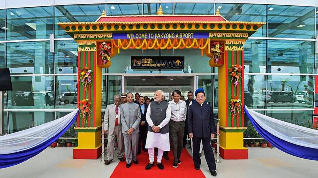 Prime Minister Narendra Modi inaugurated Pakyong Airport, Sikkim’s first-ever airport, on Monday. It is a Greenfield airport which will circumvent the need for a five-hour journey through mountainous roads and bring citizens of Sikkim closer to the state capital. Located around 60km from the Indo-China border, the airport is strategically relevant from a security point of view. (PTI / Twitter) Prime Minister Narendra Modi inaugurated Pakyong Airport, Sikkim’s first-ever airport, on Monday. It is a Greenfield airport which will circumvent the need for a five-hour journey through mountainous roads and bring citizens of Sikkim closer to the state capital. Located around 60km from the Indo-China border, the airport is strategically relevant from a security point of view. (PTI / Twitter)
