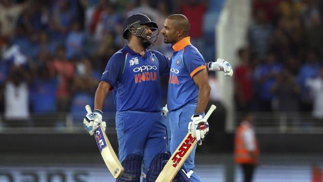 India's captain Rohit Sharma, left, hugs to congratulate teammate Shikhar Dhawan on scoring a century during the one day international cricket match of Asia Cup between India and Pakistan in Dubai, United Arab Emirates, Sunday, Sept. 23, 2018.(AP)