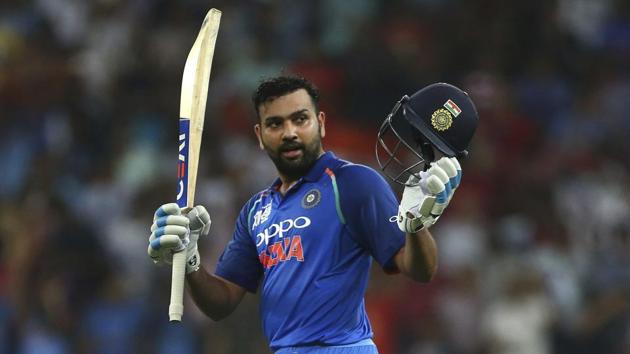 Rohit Sharma raises his bat and helmet to celebrate scoring a century during Asia Cup 2018 match against Pakistan. (AP) Rohit Sharma raises his bat and helmet to celebrate scoring a century during Asia Cup 2018 match against Pakistan. (AP)