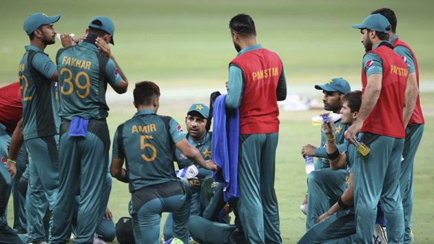Pakistan's captain Sarfraz Ahmed, center facing camera, interacts with teammates at a drinks break during the one day international cricket match of Asia Cup between India and Pakistan (AP) Pakistan's captain Sarfraz Ahmed, center facing camera, interacts with teammates at a drinks break during the one day international cricket match of Asia Cup between India and Pakistan (AP)