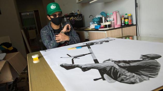 Speaking at his Bangkok studio, Headache is unrepentant. “The root of street art is that people have no rights, no voice,” he told AFP, his face masked as much for a dramatic flourish as protection from authorities. “The aim is to spread the words we want to say but cannot. So we paint them for those who walk by... for officials or the general public to understand.” (Romeo Gacad / AFP) Speaking at his Bangkok studio, Headache is unrepentant. “The root of street art is that people have no rights, no voice,” he told AFP, his face masked as much for a dramatic flourish as protection from authorities. “The aim is to spread the words we want to say but cannot. So we paint them for those who walk by... for officials or the general public to understand.” (Romeo Gacad / AFP)