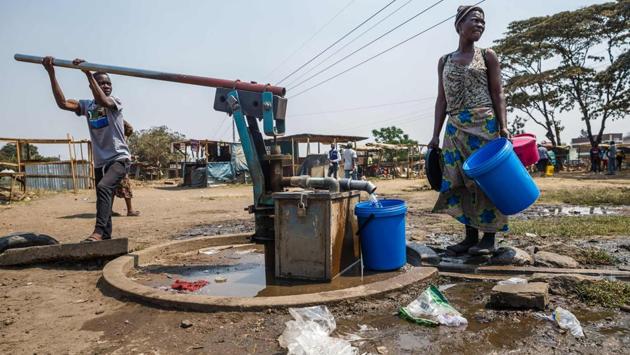 Norman Marambe said that the taps have been dry for months and when it comes, the water has a brown colour and smells. Some residents have resorted to drilling bore-holes or digging shallow wells and then locking them. Annatolia Chivanga said that if they don’t lock them thieves steal both the water and taps. (Jekesai Njikizana / AFP) Norman Marambe said that the taps have been dry for months and when it comes, the water has a brown colour and smells. Some residents have resorted to drilling bore-holes or digging shallow wells and then locking them. Annatolia Chivanga said that if they don’t lock them thieves steal both the water and taps. (Jekesai Njikizana / AFP)