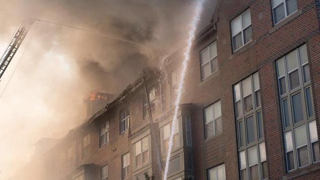 Fire fighters dousing the fire at Arthur Capper Senior Public Housing complex in southeast Washington on September 19.(Twitter/ @MayorBowser)