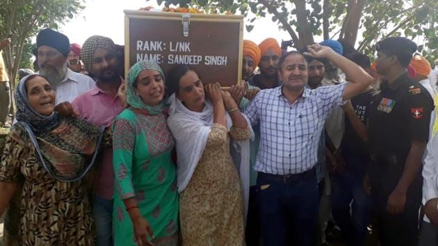 Martyr Lance Naik Sandeep Singh ,who was killed in a counter infiltration operation against militants in the Tangdhar Sector of Kupwara district in Jammu and Kashmir, was cremated with military and civil honours at his native village.(HT PHOTO)