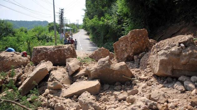 A road blocked on the outskirts of Jammu after a landslide occurred on Tuesday. (Nitin kanotra/Ht)