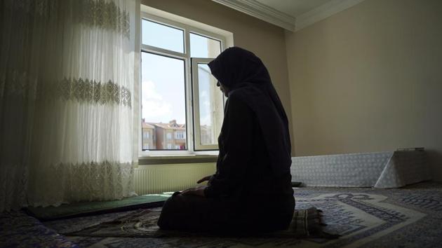 Meripet, 29, prays at her home in Istanbul. Her family is among tens of thousands swept up in President Xi Jinping’s campaign to subdue a sometimes restive region, including the internment of more than 1 million Uighurs and other Muslim minorities that has alarmed a UN panel and the US government. Now there is evidence that the government is placing the children of detainees and exiles into orphanages across Xinjiang. (Dake Kang / AP) 