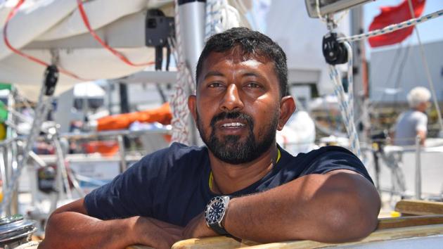 India's skipper Abhilash Tomy poses on his boat "Thuriya" in Les Sables d'Olonne Harbour, ahead of the solo around-the-world sailing race for the "Golden Globe Race" ocean race in which sailors compete without high technology aides such as GPS or computers.(AFP File Photo)