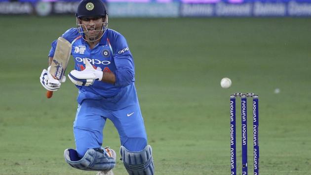 India's Mahendra Singh Dhoni reacts after playing a shot during the one day international cricket match of Asia Cup between India and Bangladesh (AP)