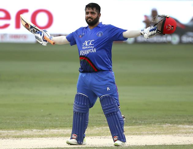 Afghanistan's Mohammad Shahzad celebrates scoring a century during the one day international cricket match of Asia Cup. (AP)