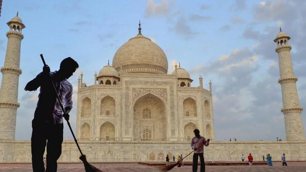 Workers sweep the premises of Taj Mahal under 'Swachhta hi Seva' campaign, in Agra.(PTI/File Photo)