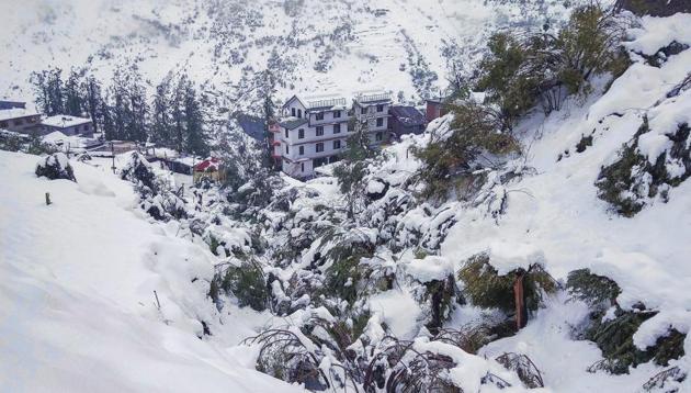 Snow-covered hills at Keylong in Lahaul Spiti district on Monday. The tribal district of Lahaul and Spiti experienced heavy rain and snowfall.(PTI)